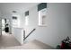 Bright hallway with natural light, showcasing the staircase and upper-level landing area at 746 Astor Dr, Carmel, IN 46032