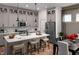 Modern kitchen featuring a spacious island, stainless steel appliances, and a dining area for casual meals at 746 Astor Dr, Carmel, IN 46032