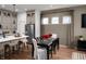 Modern kitchen featuring a spacious island, stainless steel appliances, and a dining area for casual meals at 746 Astor Dr, Carmel, IN 46032