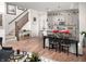 Open-concept living space showcasing a modern kitchen, staircase, and stylish dining area for seamless entertaining at 746 Astor Dr, Carmel, IN 46032