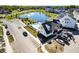 Aerial view of the community featuring a pond, pool, common area, and neighborhood at 754 Astor Ln, Carmel, IN 46032