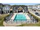 Aerial view of the community pool with lounge chairs and covered pool house at 754 Astor Ln, Carmel, IN 46032