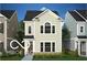 Charming two-story home featuring light siding, dark roof, and a welcoming front entrance at 754 Astor Ln, Carmel, IN 46032