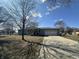 Attractive single-Gathering home with a covered porch, attached garage, and long driveway, set on a sunny lot at 7610 Brehob Rd, Indianapolis, IN 46217