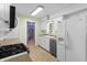 Functional kitchen featuring modern appliances, ample cabinet space, and tile flooring at 7610 Brehob Rd, Indianapolis, IN 46217
