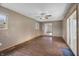 Inviting living room featuring wood flooring and a ceiling fan for added comfort at 7610 Brehob Rd, Indianapolis, IN 46217