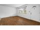 Bright living room with wood floors and a large window offering plenty of natural light at 7610 Brehob Rd, Indianapolis, IN 46217