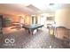 Basement featuring a pool table and two refrigerators and bar area at 7811 W 700 S, Jamestown, IN 46147