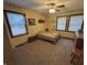 Cozy bedroom with a ceiling fan, multiple windows, and neutral carpet and walls at 7811 W 700 S, Jamestown, IN 46147