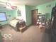 Bedroom featuring carpet, ceiling fan, and a small bed and shelving at 7811 W 700 S, Jamestown, IN 46147