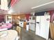 View of an expansive kitchen with double door refrigerator and dining area at 7811 W 700 S, Jamestown, IN 46147