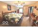 Spacious main bedroom with wooden furnishings and natural light from a window at 7811 W 700 S, Jamestown, IN 46147