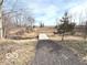 Landscaped path with a small stream leading to a foot bridge and open field, great for a stroll at 7811 W 700 S, Jamestown, IN 46147