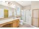 Clean bathroom with a shower, toilet, large mirror and vanity with storage space at 8535 Fenton Tower Dr, Indianapolis, IN 46259