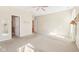 Large primary bedroom with an adjacent bathroom, neutral color scheme, and plush carpeting at 8535 Fenton Tower Dr, Indianapolis, IN 46259