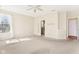 Spacious bedroom with a ceiling fan, plush carpeting and a large window allowing natural light at 8535 Fenton Tower Dr, Indianapolis, IN 46259