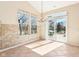 Bright dining area with backyard access, large windows, and elegant chandelier at 8535 Fenton Tower Dr, Indianapolis, IN 46259