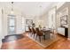 Bright dining room boasts hardwood floors, modern lighting, and a stylish dining table set at 8535 Fenton Tower Dr, Indianapolis, IN 46259