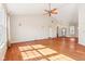 Bright and airy living room with hardwood floors, vaulted ceilings, and large windows at 8535 Fenton Tower Dr, Indianapolis, IN 46259