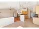 Open-concept living room and kitchen featuring vaulted ceilings, hardwood floors, and natural light at 8535 Fenton Tower Dr, Indianapolis, IN 46259