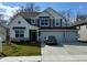 Charming two-story home featuring a three-car garage and a well-manicured lawn at 8623 Lester Pl, Pendleton, IN 46064