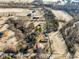 Expansive aerial view of a multi-structure property with agricultural land and mature trees at 1001 N 750 W, Bargersville, IN 46106
