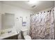 Functional bathroom featuring a vanity, toilet, and shower with marble curtain at 1001 N 750 W, Bargersville, IN 46106