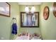 Well-lit bathroom with a classic vanity, framed mirror, and decor at 1001 N 750 W, Bargersville, IN 46106