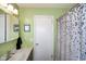 Bathroom featuring a white door, raindrop shower curtain and sink at 1001 N 750 W, Bargersville, IN 46106