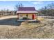 Charming cottage-style home with a red metal roof and inviting front porch at 1001 N 750 W, Bargersville, IN 46106