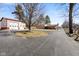Property view showcasing a large driveway, an auxiliary garage, and a ranch style home at 1001 N 750 W, Bargersville, IN 46106