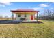 Charming cottage with a red metal roof, bench seating, and a neatly kept lawn, ideal for relaxation at 1001 N 750 W, Bargersville, IN 46106