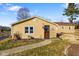 A cozy single-story home featuring a well-maintained lawn and inviting walkway to the entrance at 1001 N 750 W, Bargersville, IN 46106