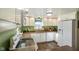Well-lit kitchen showcasing white cabinets, wood floors, and updated appliances at 1001 N 750 W, Bargersville, IN 46106