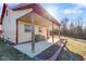 Inviting covered porch area with a swing bench, perfect for relaxing outdoors at 1001 N 750 W, Bargersville, IN 46106