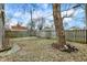 Backyard showcasing a tree, lawn, and wooden fence at 118 S 11Th Ave, Beech Grove, IN 46107