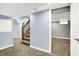 This basement features carpeted flooring, stairs, and neutral-colored walls at 118 S 11Th Ave, Beech Grove, IN 46107