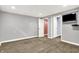 A finished basement features carpeted floors, ample lighting, and versatile living space at 118 S 11Th Ave, Beech Grove, IN 46107