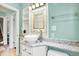 A stylish bathroom features a vessel sink, granite countertop, and modern fixtures at 118 S 11Th Ave, Beech Grove, IN 46107