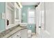 A stylish bathroom features a vessel sink, granite countertop, and modern fixtures at 118 S 11Th Ave, Beech Grove, IN 46107