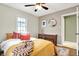 Charming bedroom features a light-filled window, comfortable bed, and stylish furniture at 118 S 11Th Ave, Beech Grove, IN 46107