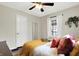 Cozy bedroom with light-filled window, wood flooring and a neutral color scheme at 118 S 11Th Ave, Beech Grove, IN 46107