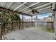 A spacious covered deck offers a relaxing outdoor space with a ceiling fan at 118 S 11Th Ave, Beech Grove, IN 46107