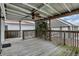 Enjoy outdoor living on this covered deck with a ceiling fan and fenced backyard view at 118 S 11Th Ave, Beech Grove, IN 46107