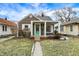 Charming home with a well-maintained front yard, covered entry, and appealing exterior features at 118 S 11Th Ave, Beech Grove, IN 46107