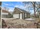This detached two-car garage features a basketball hoop and ample parking space at 118 S 11Th Ave, Beech Grove, IN 46107