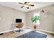 Inviting home office features a modern desk, comfortable chair, and natural light from the window at 118 S 11Th Ave, Beech Grove, IN 46107