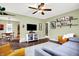 Inviting living room featuring hardwood floors, a ceiling fan, and comfortable seating at 118 S 11Th Ave, Beech Grove, IN 46107
