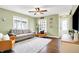 A welcoming living room featuring hardwood floors, comfortable seating, and plenty of natural light at 118 S 11Th Ave, Beech Grove, IN 46107