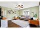 Cozy living room with hardwood floors, stylish seating, and a view to a bright window at 118 S 11Th Ave, Beech Grove, IN 46107